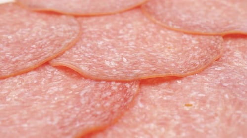 Sliced Raw Smoked Salami Sausage Spun As a Restaurant Backdrop Fresh Cured Sausage for a Sandwich