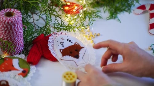 Hands Crafting Whimsical Felt Christmas Ornaments