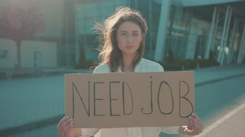 In Need of Job Young Unhappy Woman Holding a Job Search Banner Hoping for Employment Striking