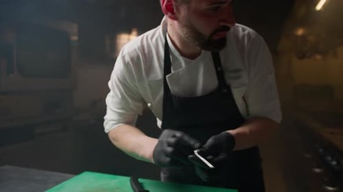 Chef Cuts Seafood in Commercial Kitchen