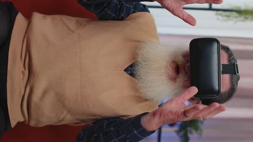 Senior Man Using Virtual Reality Headset at Home