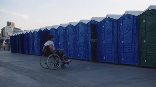 Young Adult in Wheelchair on Path