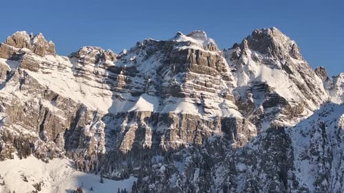 Snow-covered alpine peaks – Fronalpstock mountain drone view in Switzerland