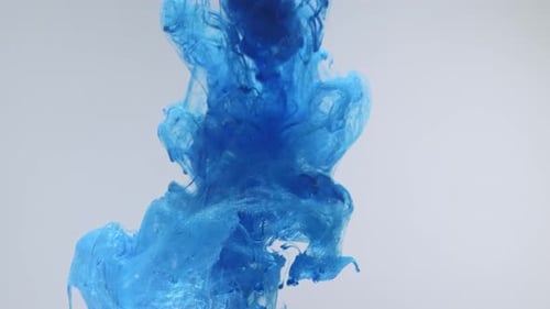 Moody Blue Ink Dropping and Spreading in Water
