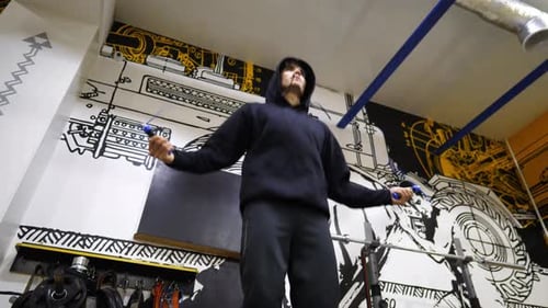 Strong Sporty Man Skipping with a Jump Rope at Modern Gym Athletic Guy in Sportswear Doing Cardio at