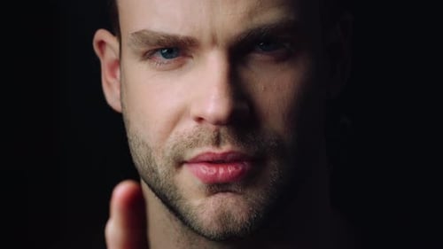 Close Up View of Serious Businessman Touching Invisible Screen in Office. Focused