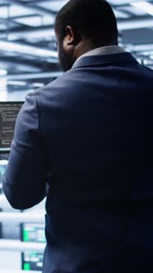 Vertical Video Admin in Data Center Running Error Checking Utilities on Tablet to Fix Hardware Bugs