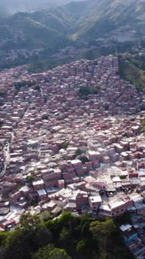 Aerial view of Comuna 13, San Javier, Medellin, Colombia, showing colorful houses covering the hills