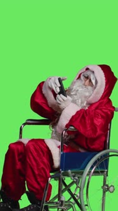 Vertical Video Side View of Man on Phone Call and Playing Videogames