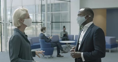 Business woman in corporate office lobby working on digital tablet technology
