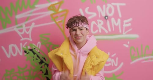 Teen Bboy Dancing Against Graffiti Wall