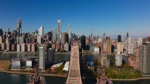 Camera Movement Glides Forward Above Queensboro Bridge Showcasing the East River and Roosevelt