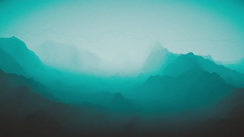 Silhouette of mountains in misty environment