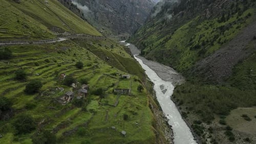 Aerial Drone footage of a river flowing in the Himalayas