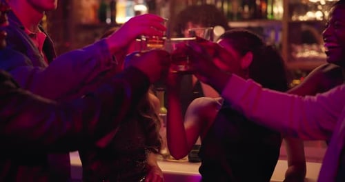 Happy people, night club and cheers with drink for party, celebration or toast together