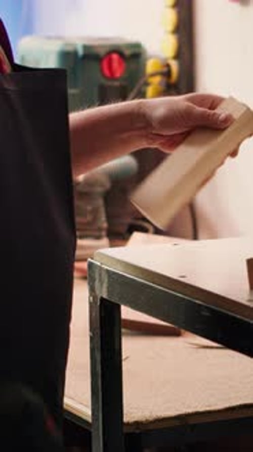 Man Drilling Wood in Workshop with Power Tools
