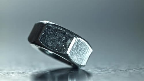 Detailed View of Turning Nut with Reflective Surface and Highlights Filmed on a Highspeed Camera at