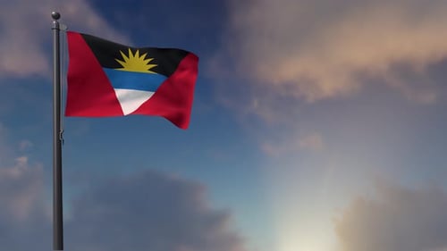 Antigua and Barbuda Flag Waving Under a Cloudy Blue Sky
