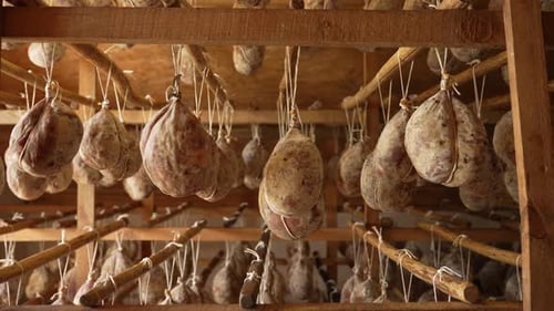 Sausages Hanging from Wooden Rack