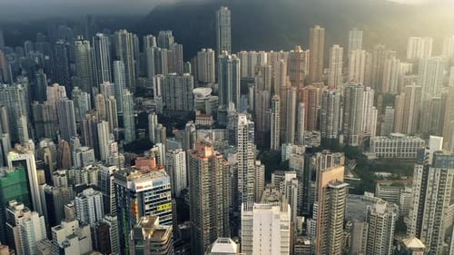Aerial view, city and buildings, skyscraper and infrastructure outdoor in urban development in Hong