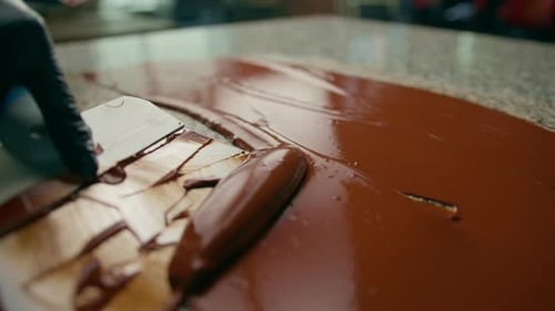 Tempering Chocolate on Granite Table in Professional Kitchen