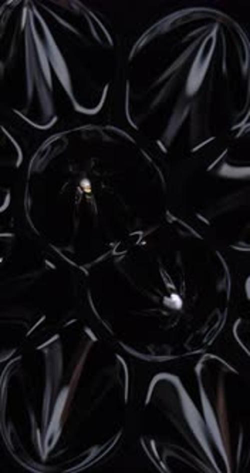 Magnetic fluid. Ferro fluid. Vertical video background, magnetic substance. Black liquid surface.
