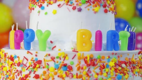 Colorful Birthday Cake with Balloons and Sprinkles