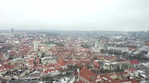 Aerial shot with a slow tilt above the old town of Vilnius, Lithuania