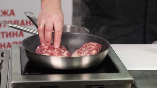 chef cook delicious meat in restaurant