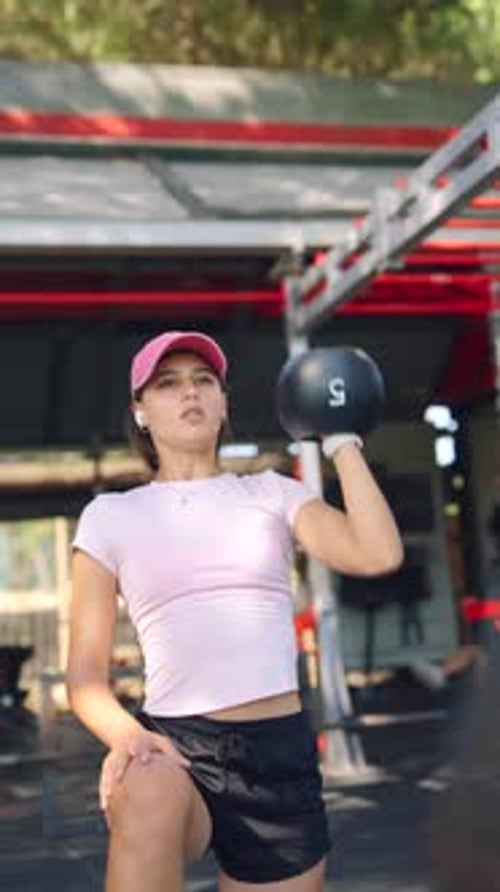 Engaging Kettlebell Workout Experience in a Fully Equipped Fitness Studio Setting