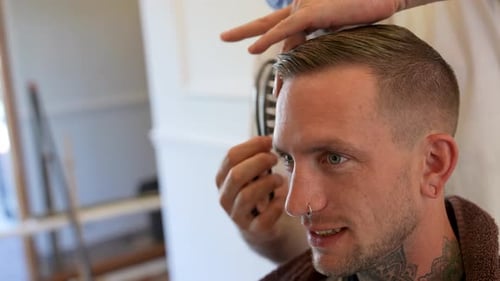 Man Gets Haircut at Barbershop Close Up