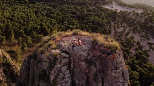 Climbing couple man and woman in the mountain. Drone view of climber sportsmen.Physical activity in