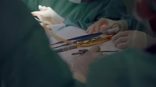 Surgeons Perform Operation with Medical Instruments