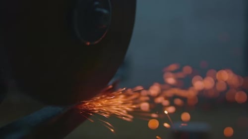 Cutting Angle Grinder Machine Cuts Metal Fly Close Up of Spinning Disk Tool with Flying Sparks
