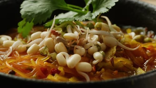 Delicious Asian Noodles with Vibrant Orange Sauce