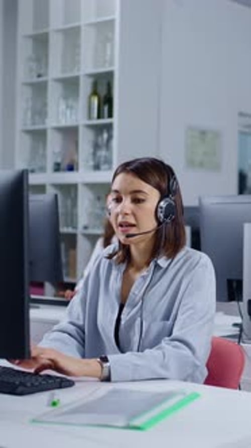 Customer Service Representatives Working in Modern Office