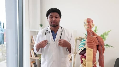 Friendly Doctor in White Coat Smiling