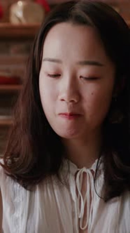 Young Woman Eating Food in a Close-Up Shot