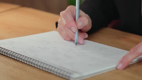 Mature Student Checking Completed Tasks in Calendar
