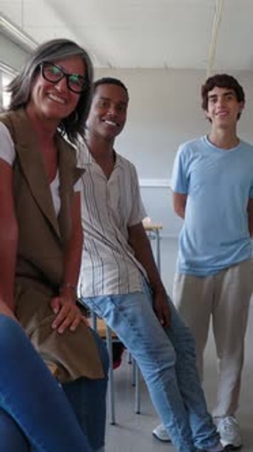 High School Student Friends with Female Teacher Standing Together in Classroom
