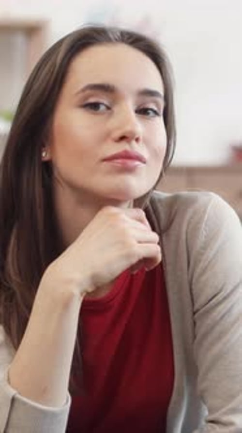 Smiling Woman with Hand on Chin Close-Up
