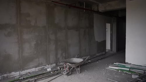 Inside the Building Under Construction Concrete Walls and Building Tools