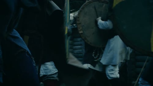 Viking Warriors Clash with Swords and Shields in Battle
