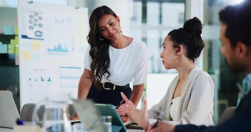 Three Adults Collaborate on Business Meeting in Modern Office