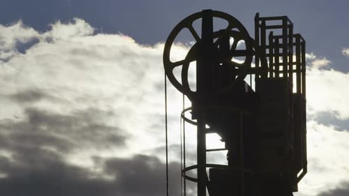 Prospecting Pit Dark Silhouette with Large Wheels