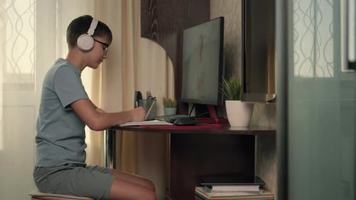 Teen Boy Attends Online School at Home