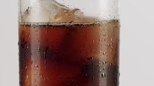 Refreshing Soda Drink with Bubbles and Ice Cubes
