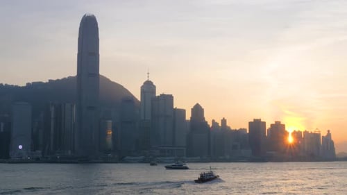As sun drops Victoria Harbour, city transforms into realm of ethereal beauty