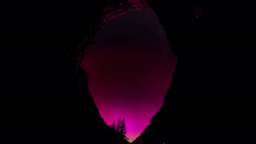 Aurora Borealis time lapse, Northern Lights over Europe. Alps mountains Austria.