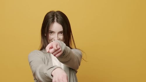 Smiling Woman Pointing with Positive Energy
